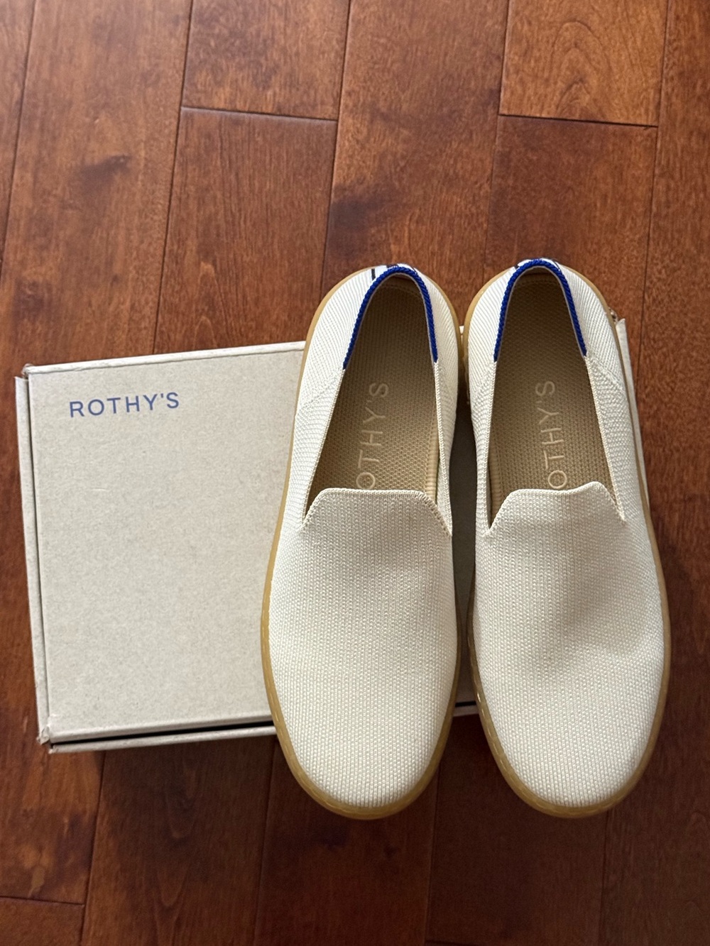 Rothy's Cream Knit Slip-On Sneakers with Blue Heel Trim